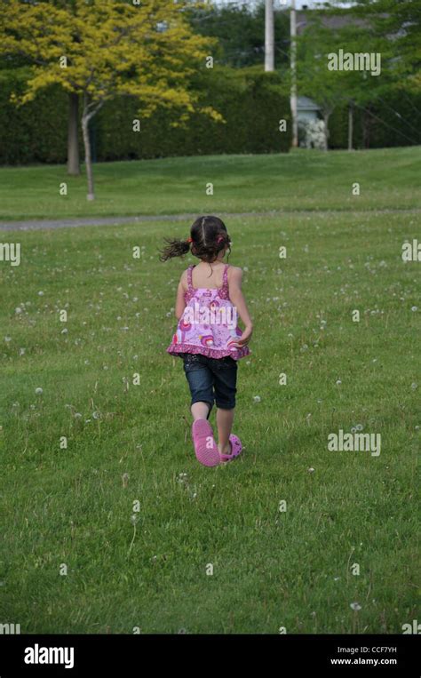 Little Girl Running In The Parc Stock Photo Alamy