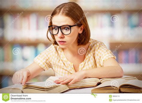 Funny Surprised Girl With Glasses Reading Books Royalty
