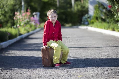 231 Child Sits Suitcase 2c Traveler Stock Photos Free And Royalty Free