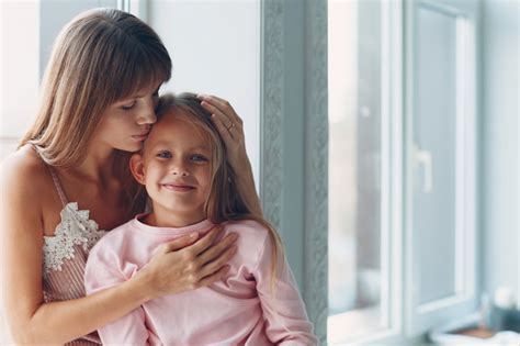 Premium Photo Beautiful Young Mother And Her Charming Little Daughter