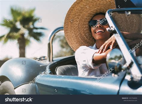 Black Woman Driving Vintage Convertible Car Stock Photo 1231764055