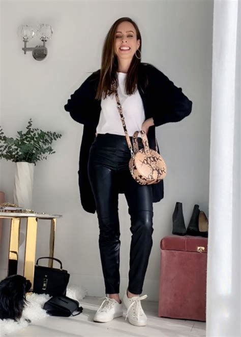 sydne style shows how to wear leather pants with sneakers and tshirt for casual outfit ideas
