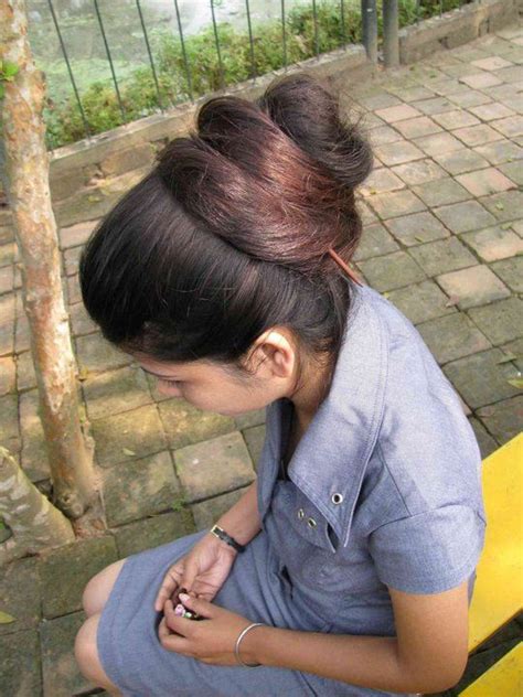 For each section, style a bun on top of the head. Pin on Long Hair in India
