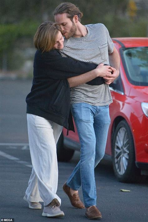Emma Watson cuddles up to rumoured fiancé Leo Robinton during stroll