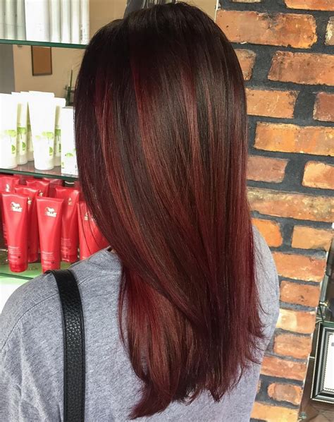 The burgundy hair with caramel highlights is a very pretty look for summer or autumn as it resembles falling leaves or a summer sunset. 50 Beautiful Burgundy Hairstyles - Hair Adviser