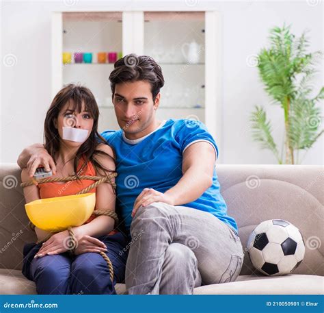 Man Tying Up His Wife To Watch Sports Football Stock Image Image Of