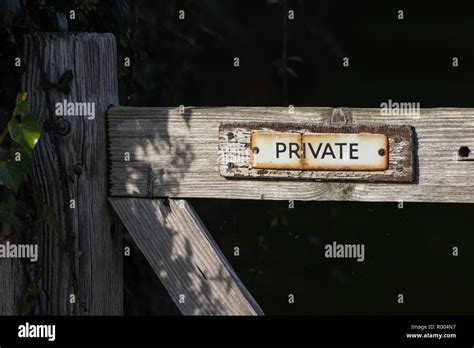A Rusty Private Sign On An Old Wooden Gate Stock Photo Alamy