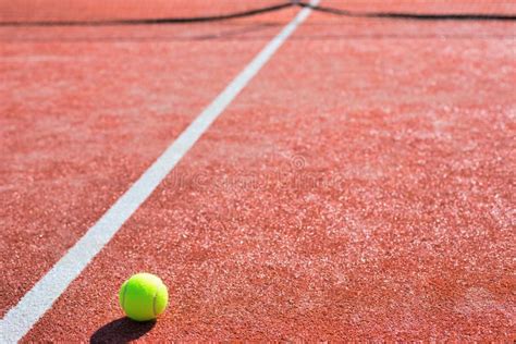 Tennis Ball On Red Court During Sunny Day Stock Image Image Of Shadow Tennis 157850091
