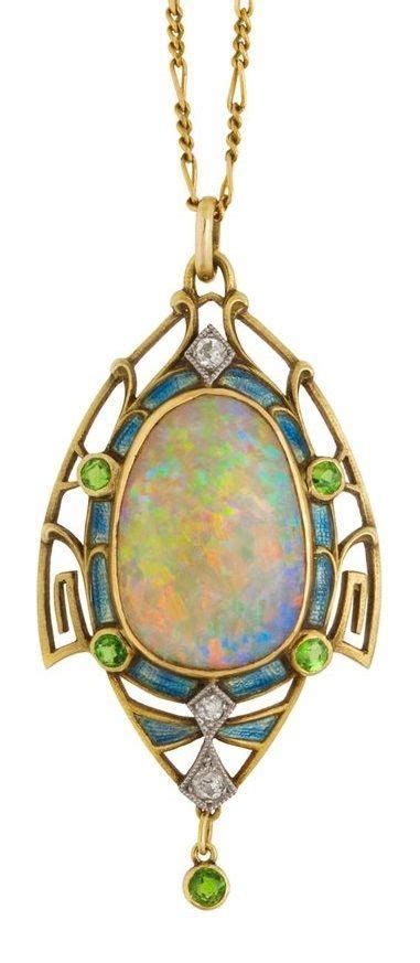 An Art Nouveau Opal Pendant Framed In Gold Set With Diamonds Enamel