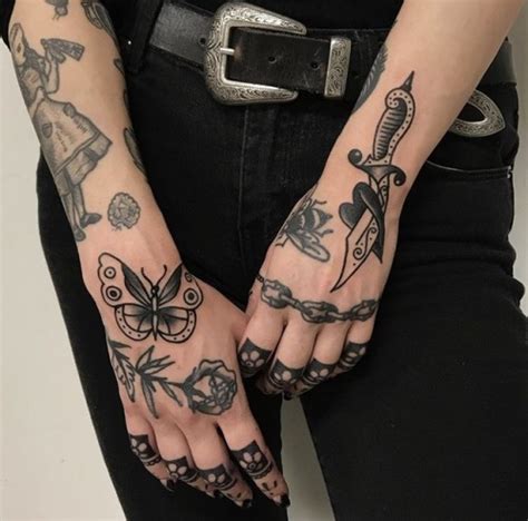 black traditional tattoos on the both hands