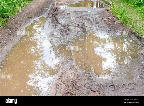 Puddle In Country Lane Hi Res Stock Photography And Images Alamy