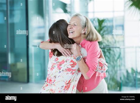 Adult Mother And Daughter Embracing Stock Photo Alamy