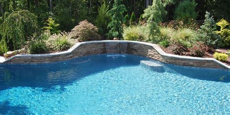 Pin By Teri P On Exterior Curved Pool Waterfall Pool Waterfall