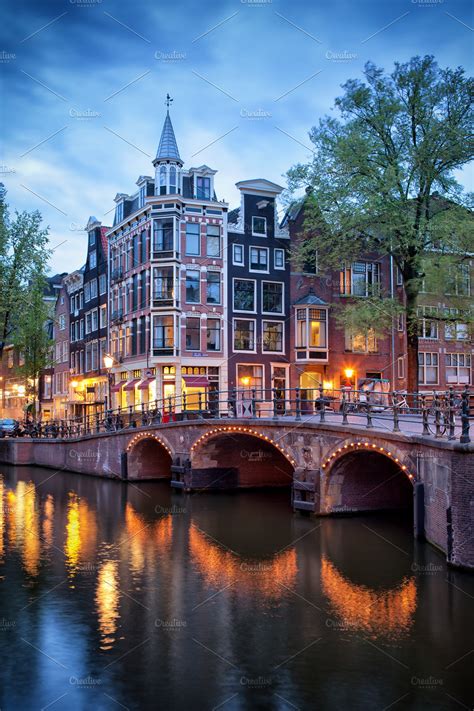 city of amsterdam at dusk containing amsterdam canal and bridge high quality architecture