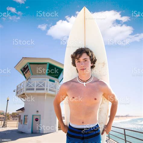 Surfer Boy Teen With Surfboard In Huntington Beach Stock Photo