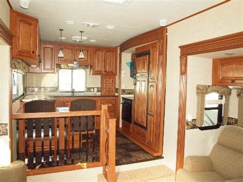 How tall is a fifth wheel in a rv? Rear kitchen on a triple slide Big Country 3690SL 5th ...