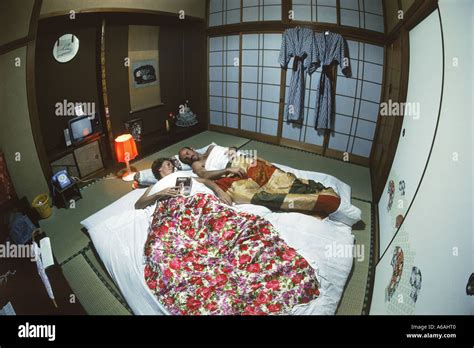 Couple Sleeping On Futon In Typical Japanese Home Or Japanese Style Bed And Breakfast Called