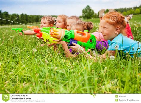 Five Kids Play With Water Guns Stock Image Image Of