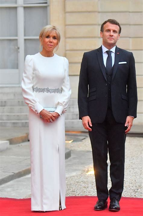 Brigitte Macron Wows In A White Puff Sleeve Gown And Silver Capped Heels