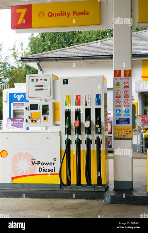 Petrol Pumps On A Shell Station Forecourt Stock Photo Alamy