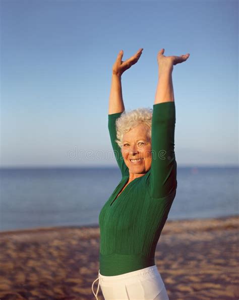 Healthy Senior Woman Practicing Yoga On Beach Stock Image Image 35127061