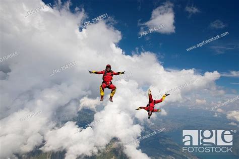 Two People Doing Parachute Jumping Full Shot Stock Photo Picture And