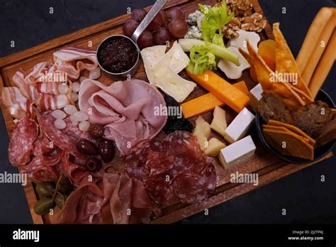 Assorted Cheese And Cold Meat Platter With Condiments Stock Photo Alamy