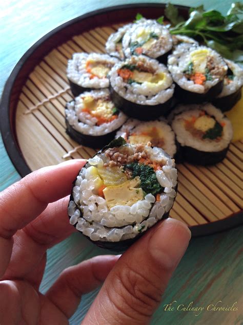Secure the roll with the exposed flap of seaweed sheet. Kimbap - Korean Seaweed Rice Rolls