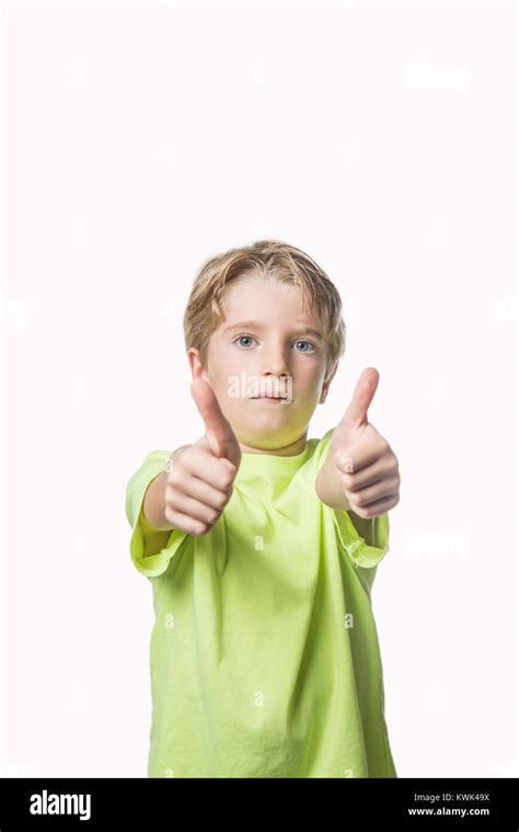 Little Boy Showing Two Thumbs Up On White Background Stock Photo Alamy