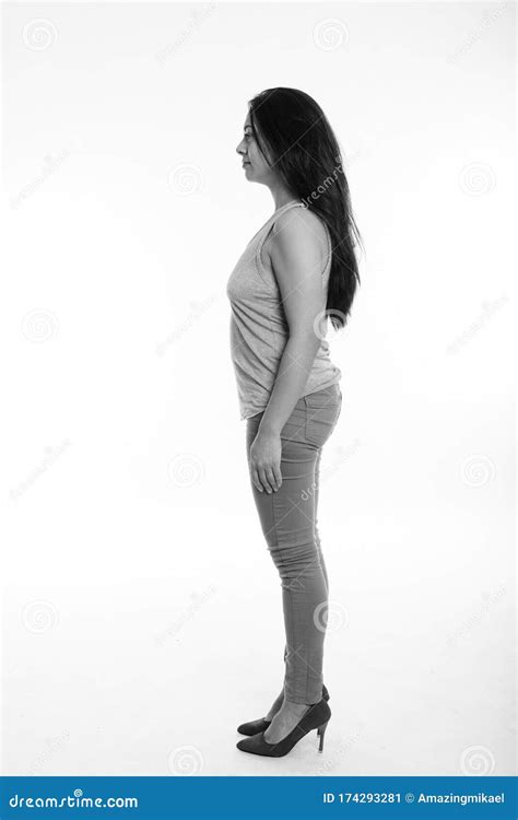 Full Body Shot Profile View Of Beautiful Woman Standing Against White Background Stock Image