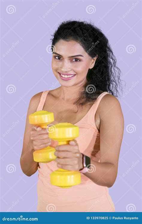 Pretty Girl Exercising Her Biceps With Dumbbells Stock Image Image Of
