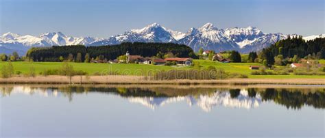 Panorama Landscape With Alps Mountains And Lake In Bavaria Stock Photo