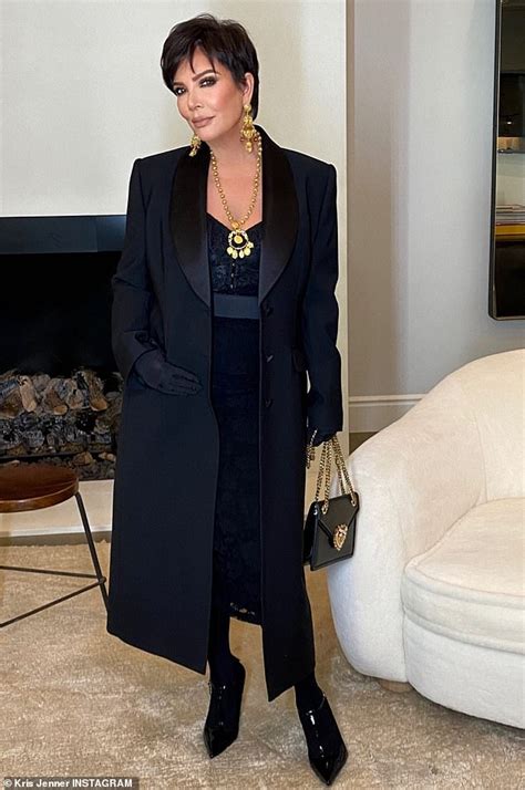 Kris Jenner Sports A Clear Face Shield And Black Pant Suit While