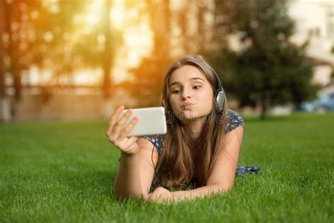 Girl Making Duck Face Outdoors Lying Down Stock Image Image Of Duck
