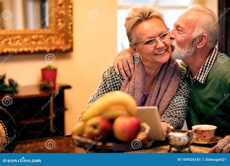Old Man Showing His Wife What Is True Love Senior Couple In Love At