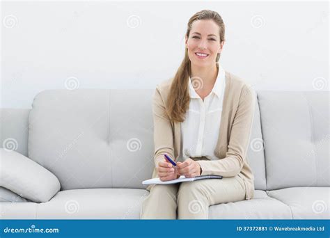 Smiling Female Psychologist Sitting On Sofa Stock Image Image Of