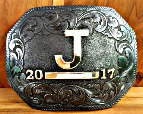 Beautifully Sculpted Scrollwork Sets Off This Custom Brand Buckle It
