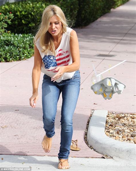 the real housewives of miami s joanna krupa trips and sends her drinks flying daily mail online