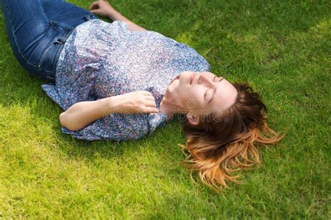 Happy Woman Lying Down On Green Grass Stock Photo Image Of Lying