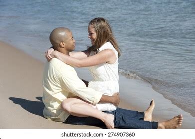 Romantic Interracial Couple Sitting Beach On Stock Photo Edit Now