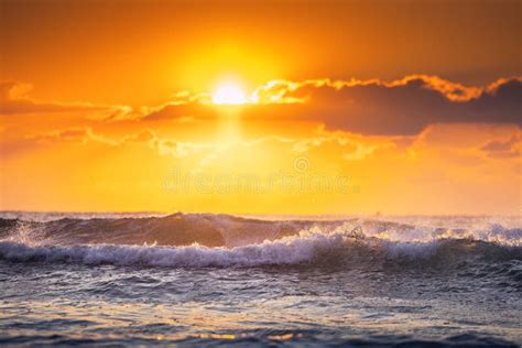 Beautiful Sunrise Wave And Dramatic Cloudscape During Scenic Sunrise