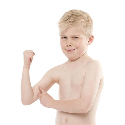 Boy Flexing His Biceps Photograph By