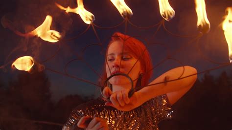Close Up Portrait Of Lovely Redhead Female Fireshow Performer Juggling