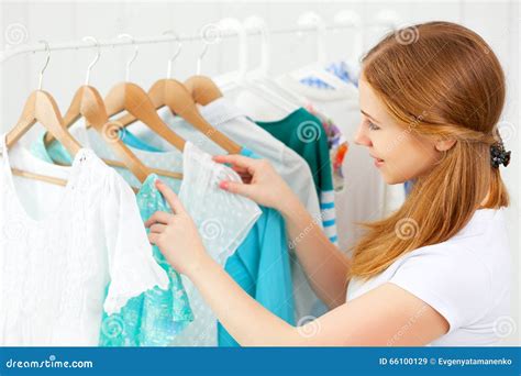 Woman Chooses Clothes In Her Wardrobe Stock Image Image Of Attractive Boutique 66100129