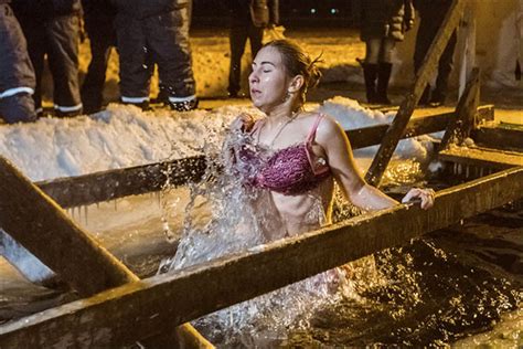 Taking The Plunge In Icy Siberian Waters Locals Mark Orthodox Epiphany