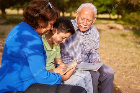 Grandpa And Grandma Helping Grandson With Homework — Stock Photo