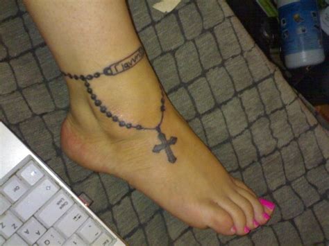 Very realistic in form, this 3d cross tattoos idea is created with a thin and sleek cross that stimulates a key. Rosary Tattoos