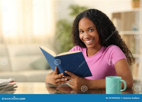 Happy Black Reader Looking At Camera Holding Book Stock Photo Image