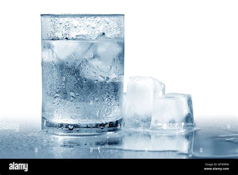 Glass Of Very Cold Water With Ice Cubes Isolated With Clipping Path