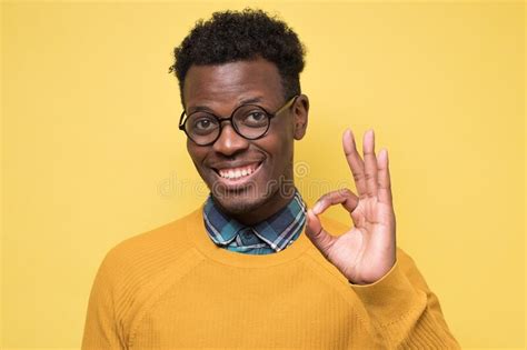 Successful Excited Young African Man Showing Ok Sign Stock Image